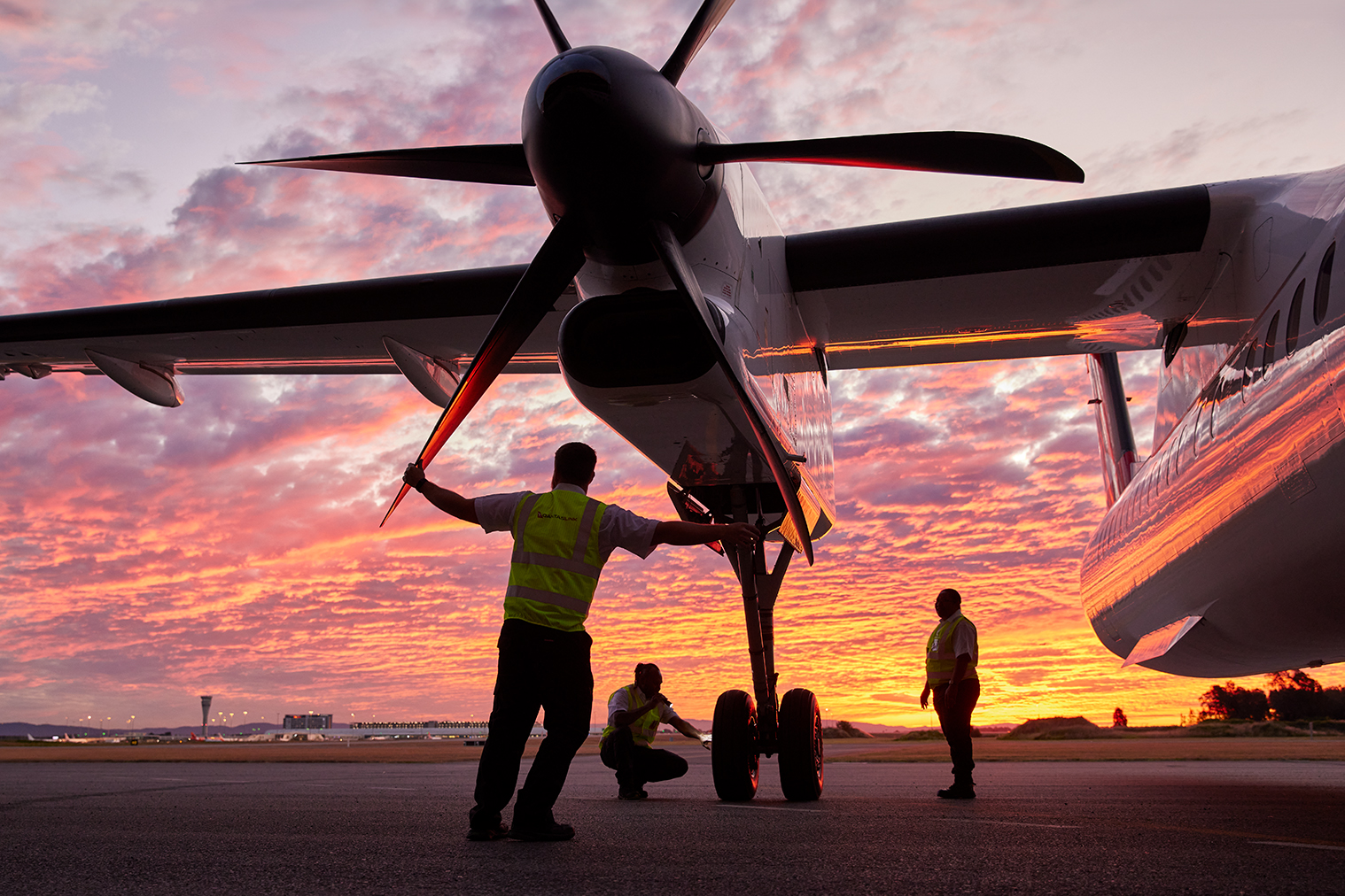 QantasLink Q400 at sunset