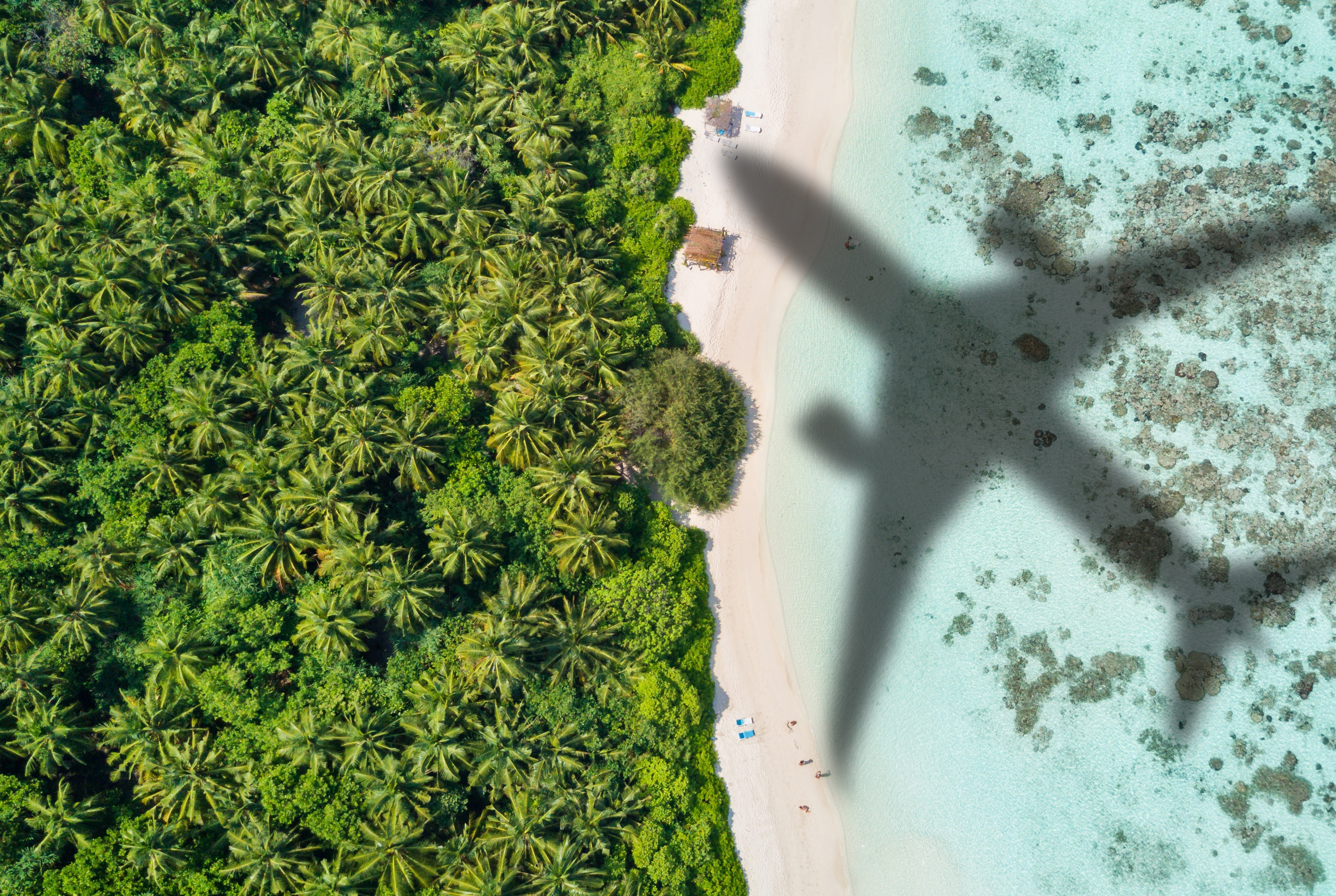 Shadow of plane over island