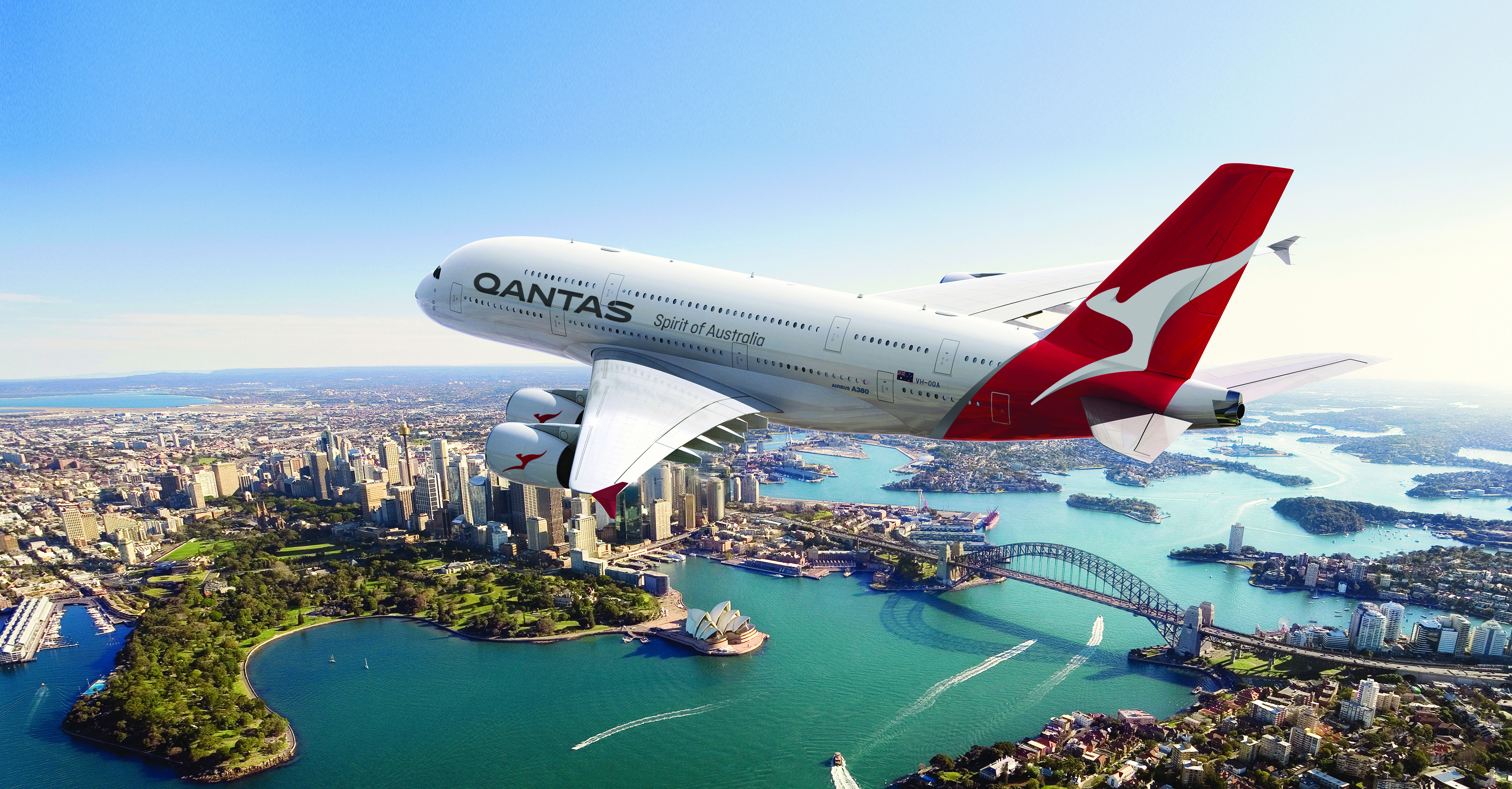 Qantas airplane flying over the city of Sydney