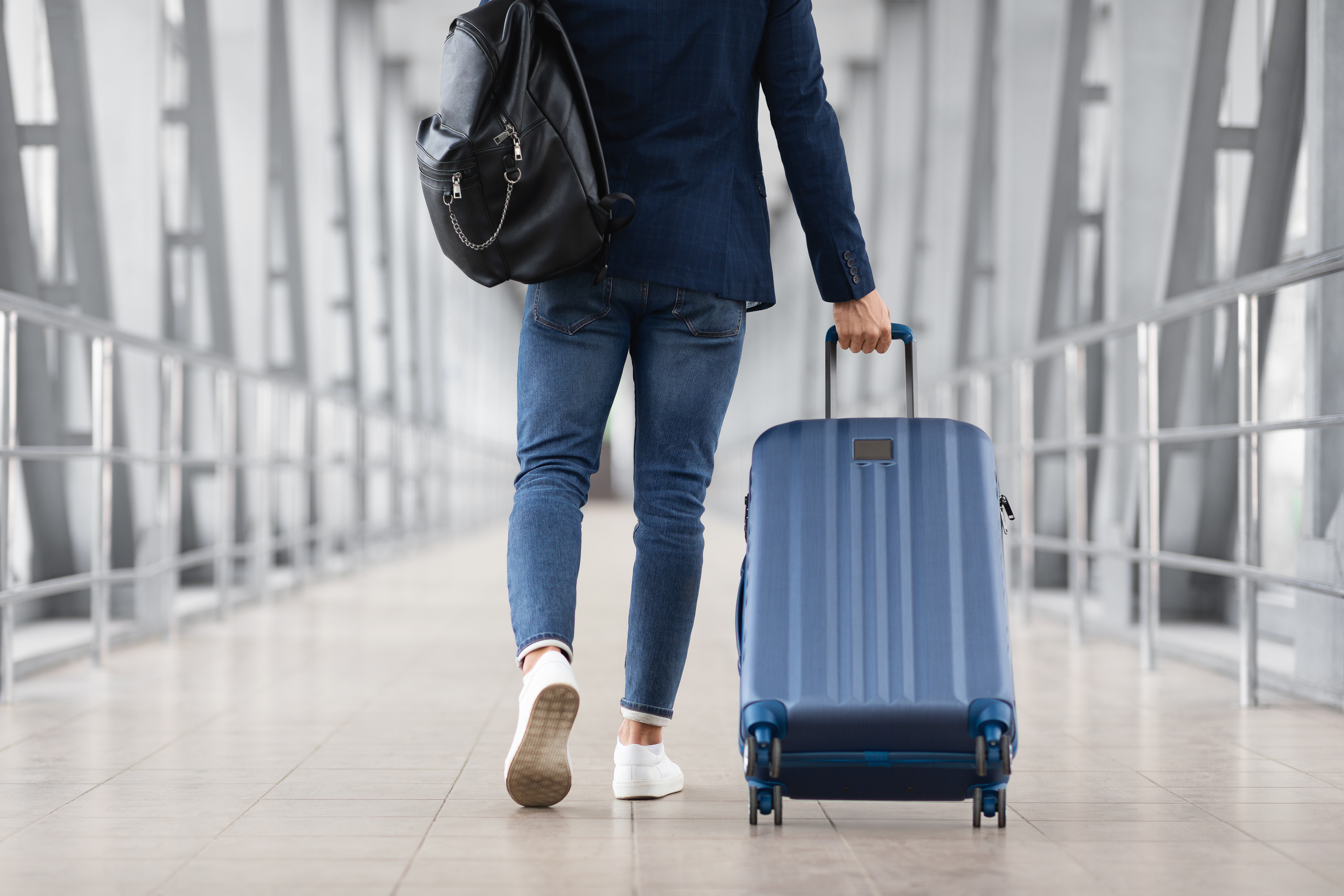 Man with luggage walking in airport