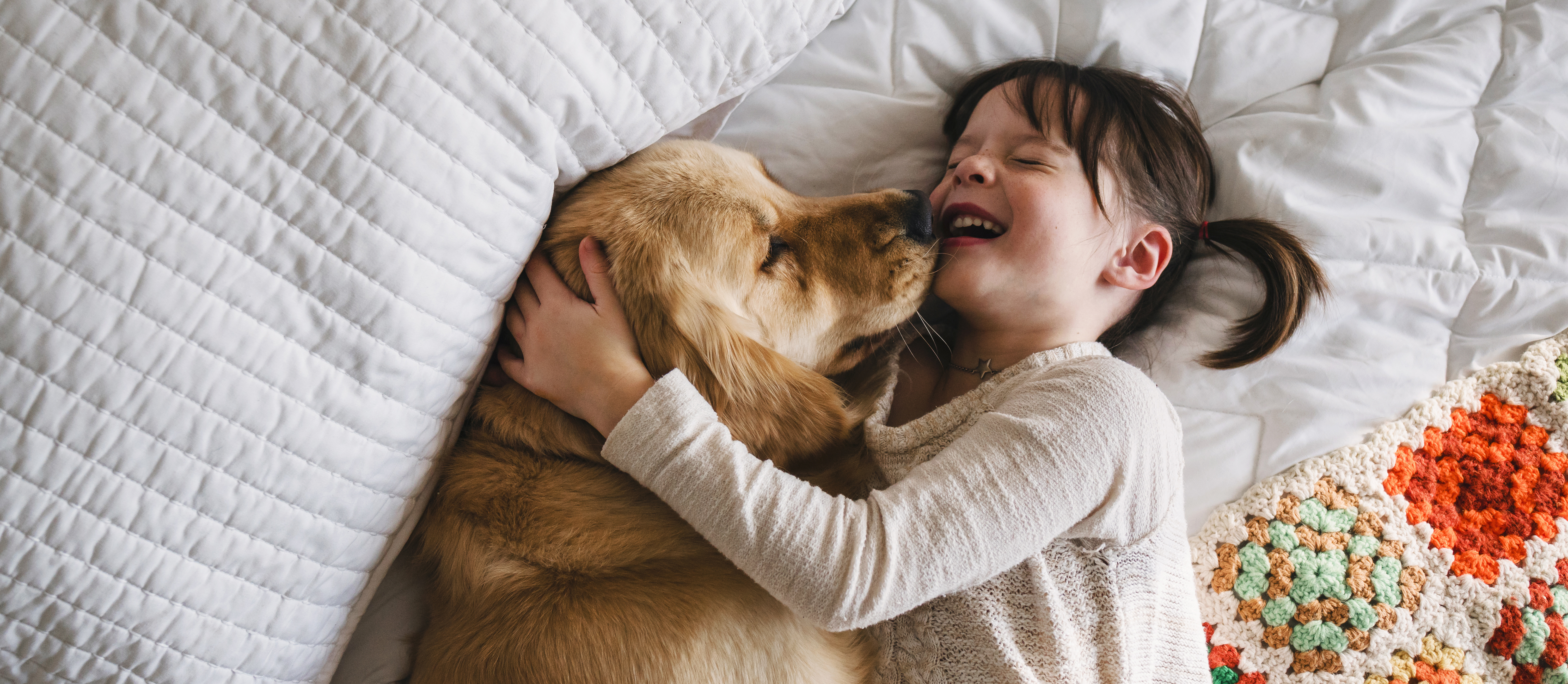 Dog and girl smiling