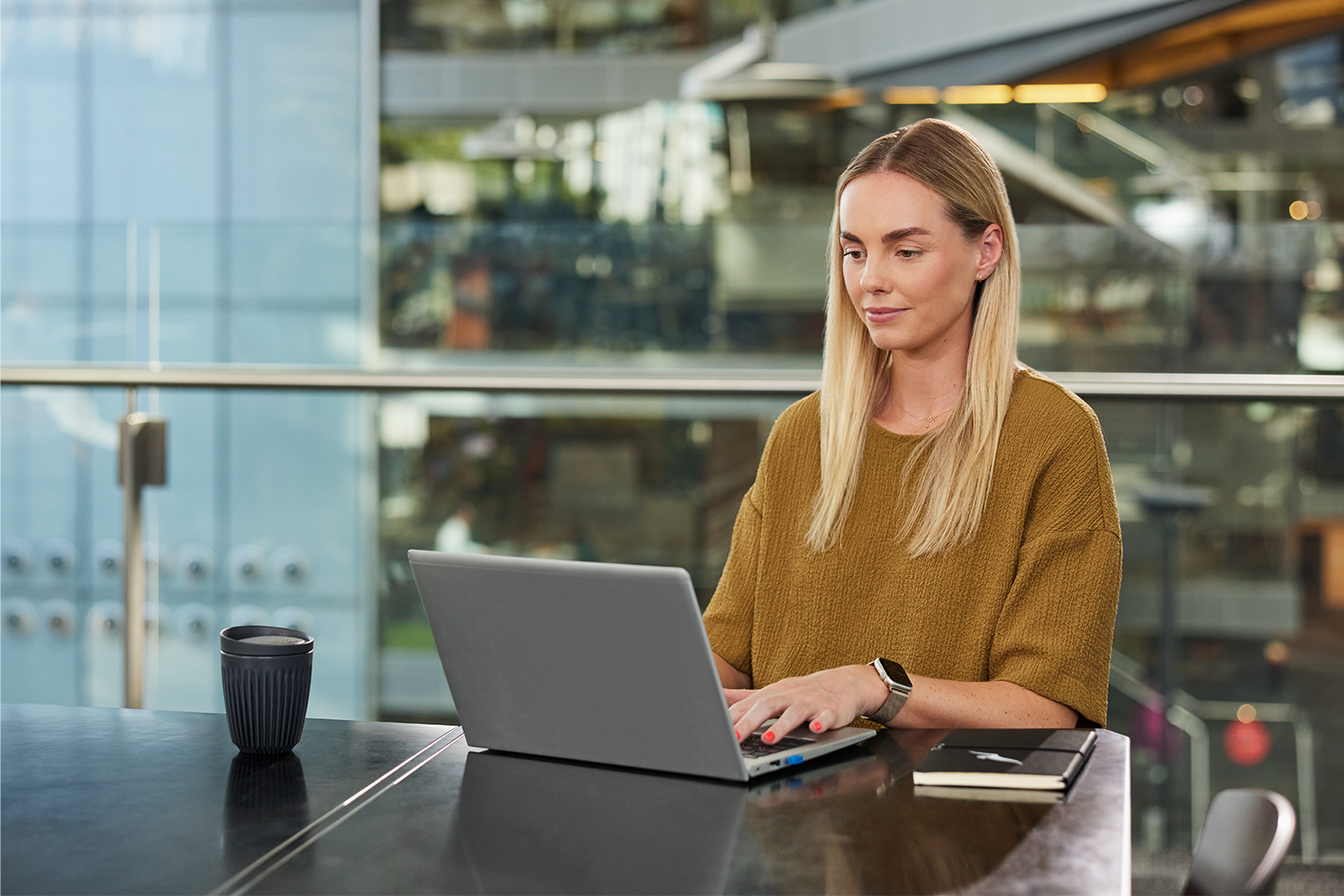 Woman on laptop in office