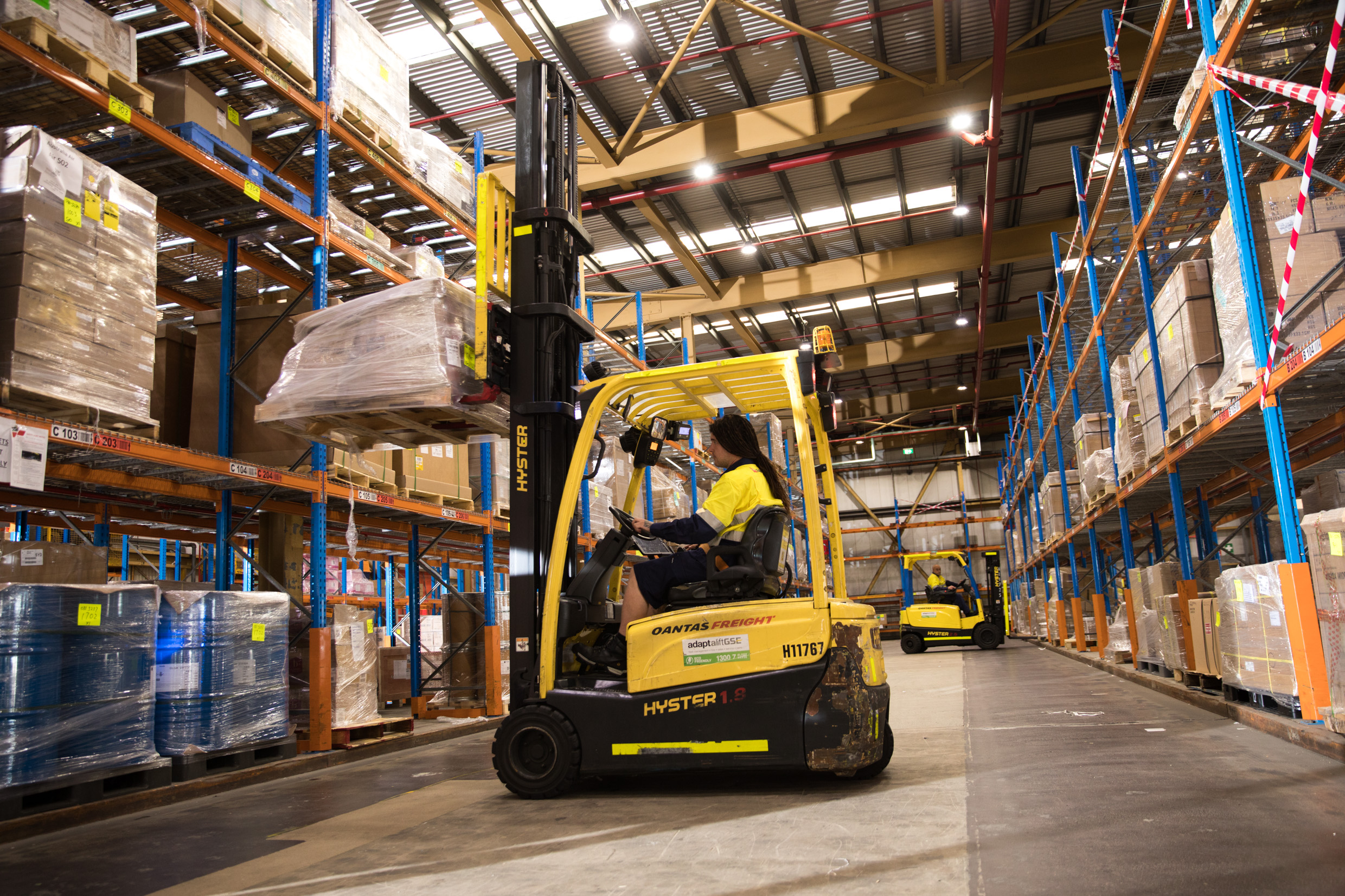 Woman on forklift in warehouse